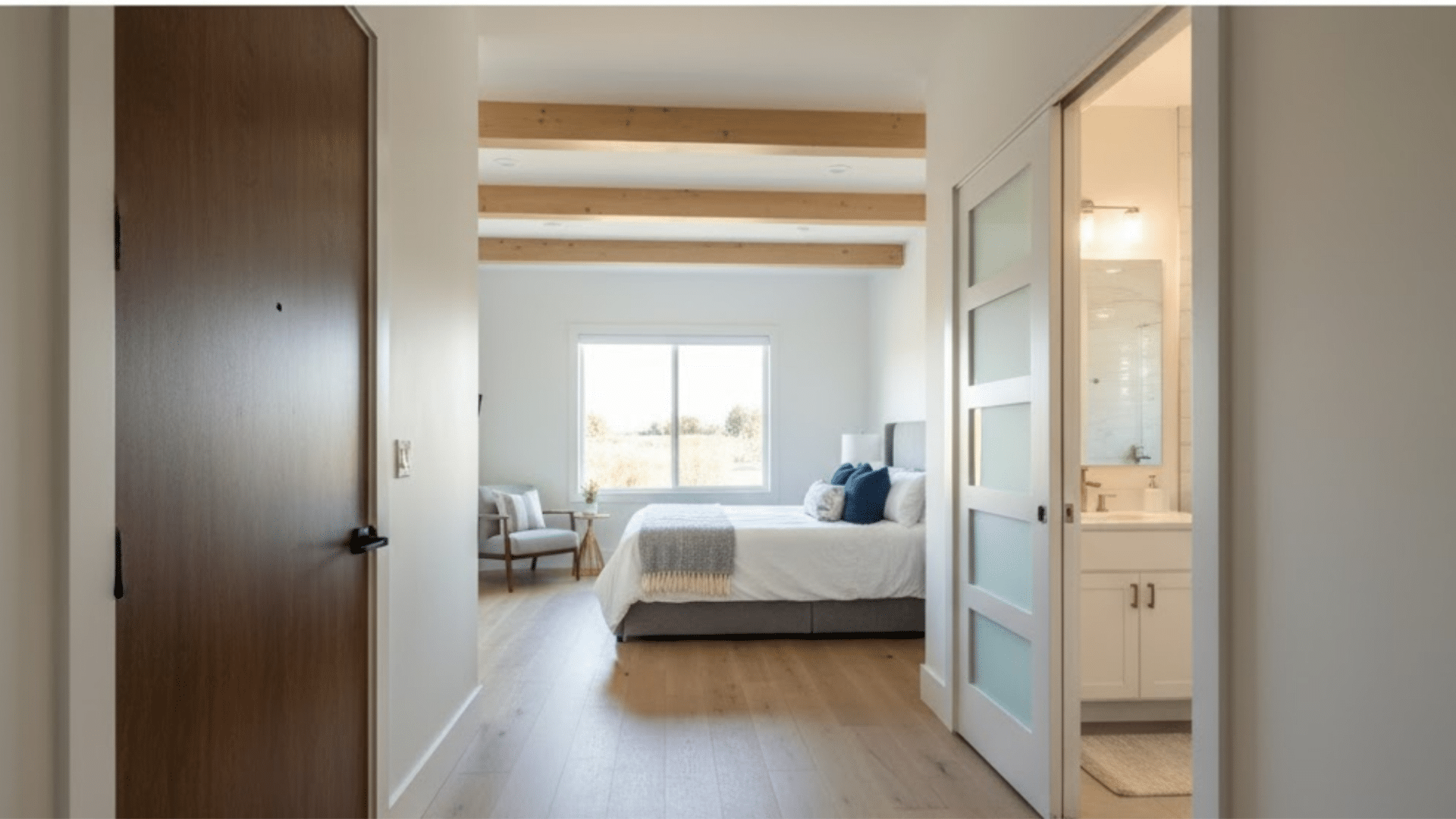 guest suite with private bedroom, ensuite bathroom, and bright modern interior.