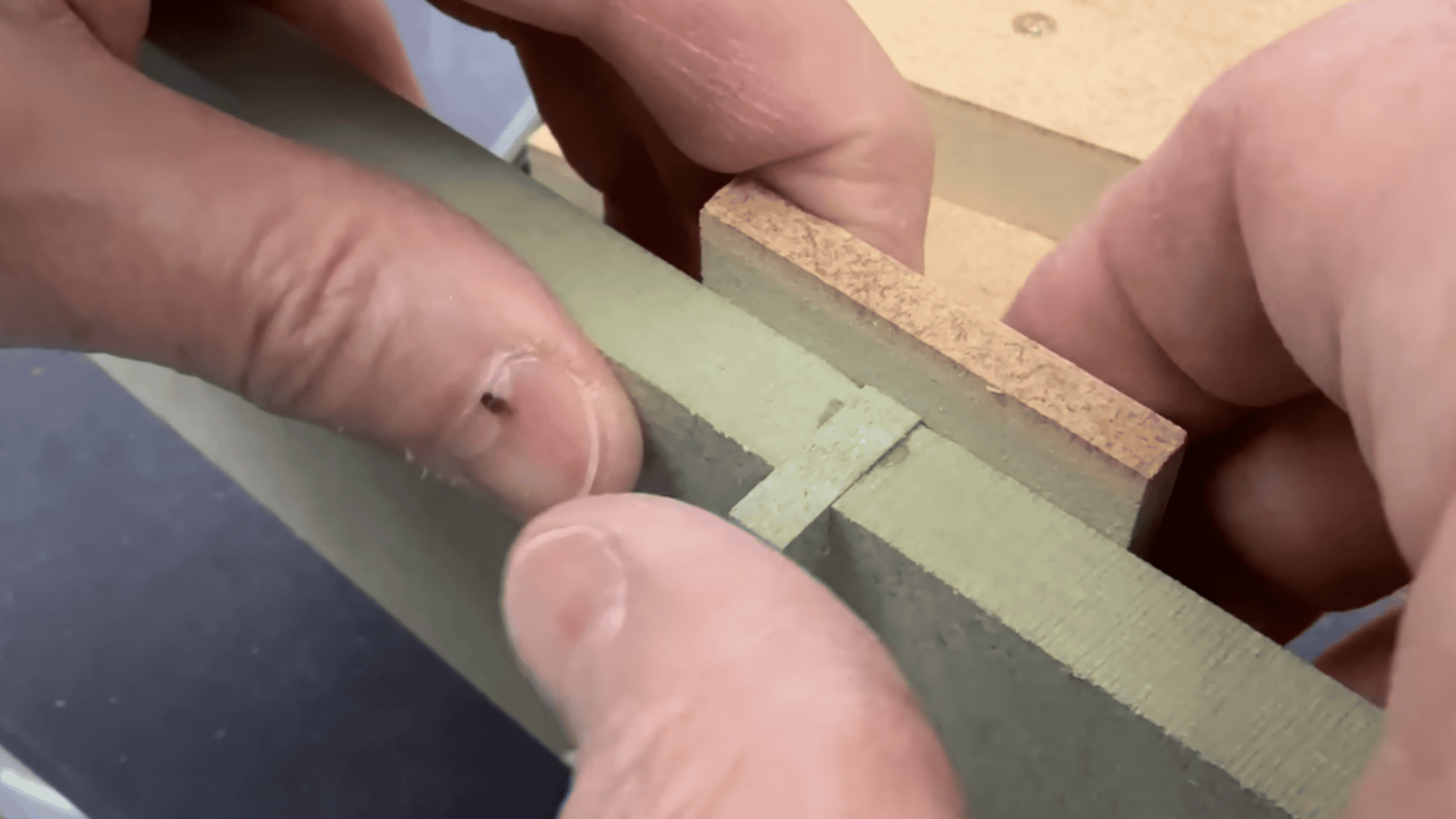 box joint jig fence with indexing peg aligned for accurate, repeatable finger spacing.