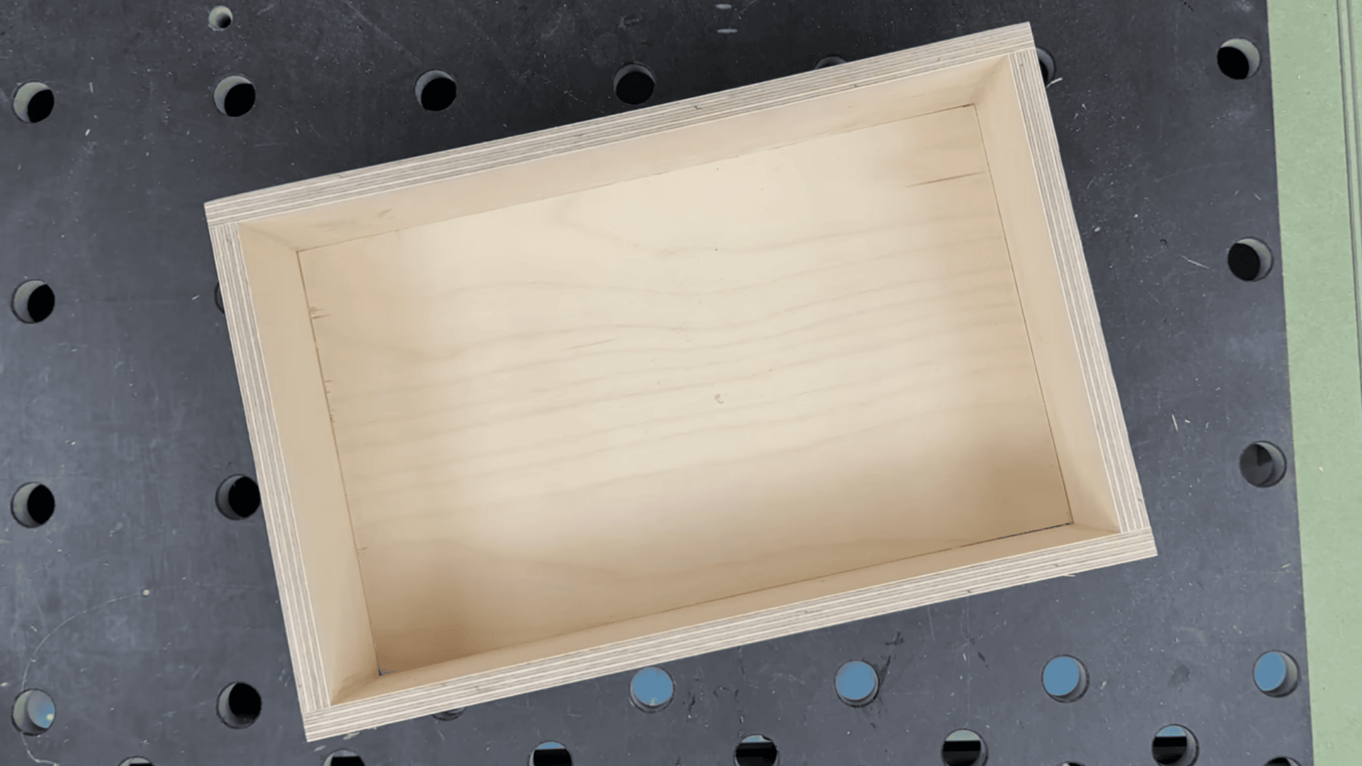 finished box joint box after gluing, sanding, and wax finish with clean interior and smooth corners.