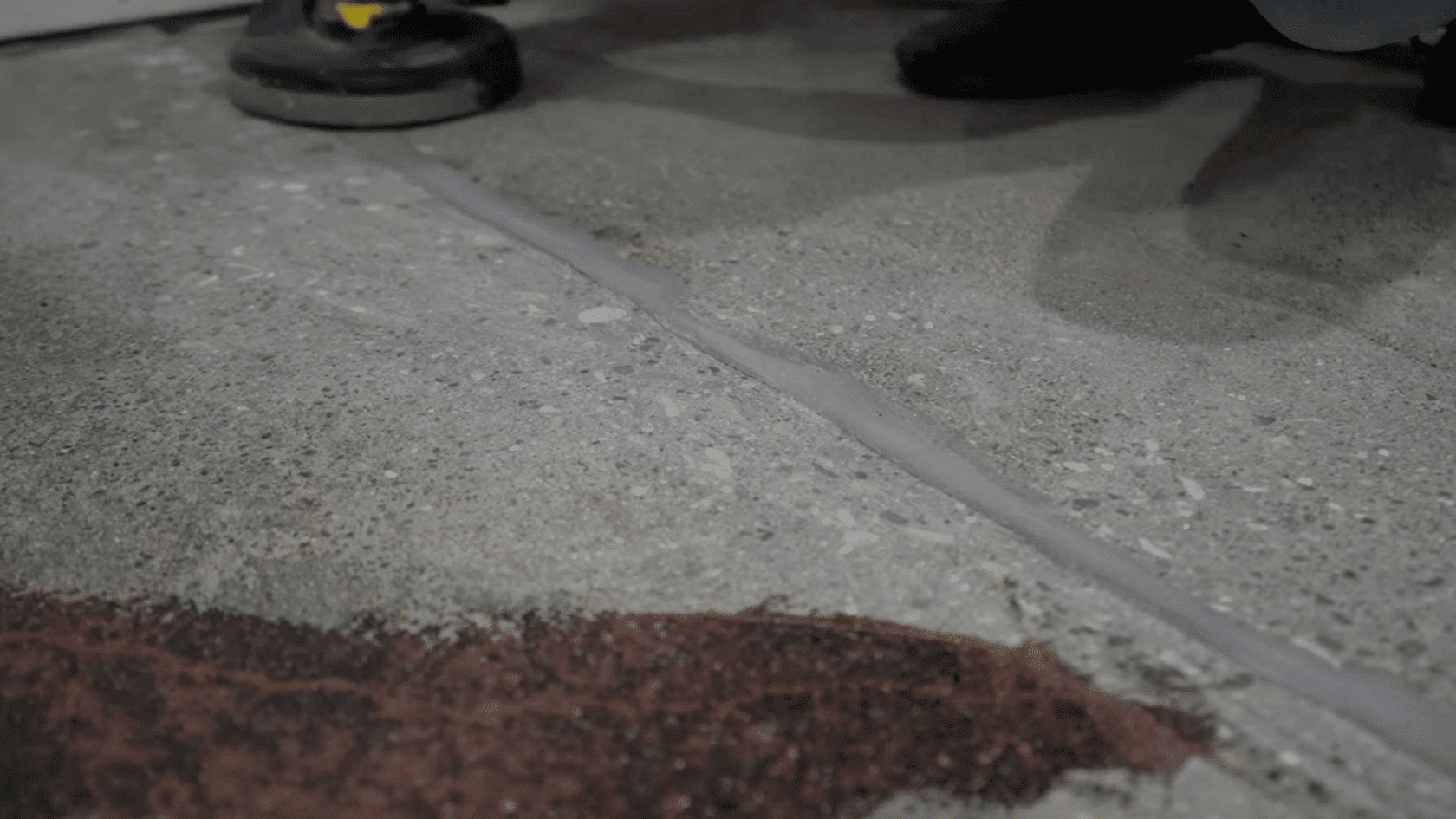 leveled concrete crack repair after curing, creating a smooth and even surface finish.