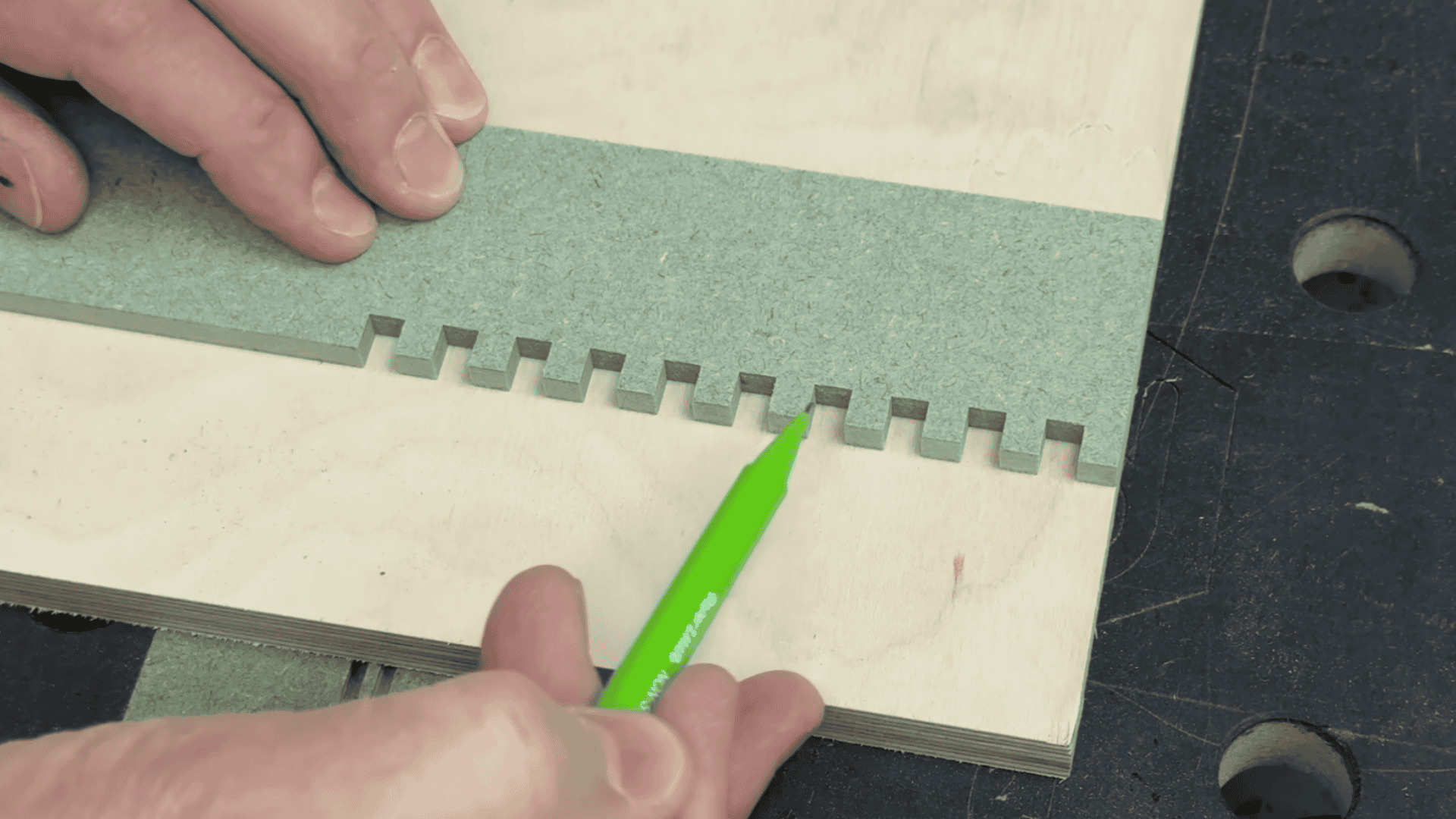 test-cut box joint fingers checked for proper spacing and fit before final woodworking cuts.