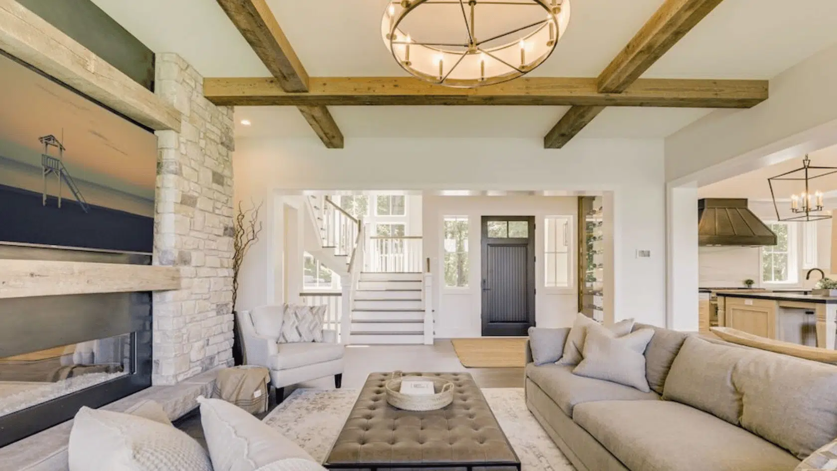 coastal living room with exposed reclaimed wood beams across the ceiling