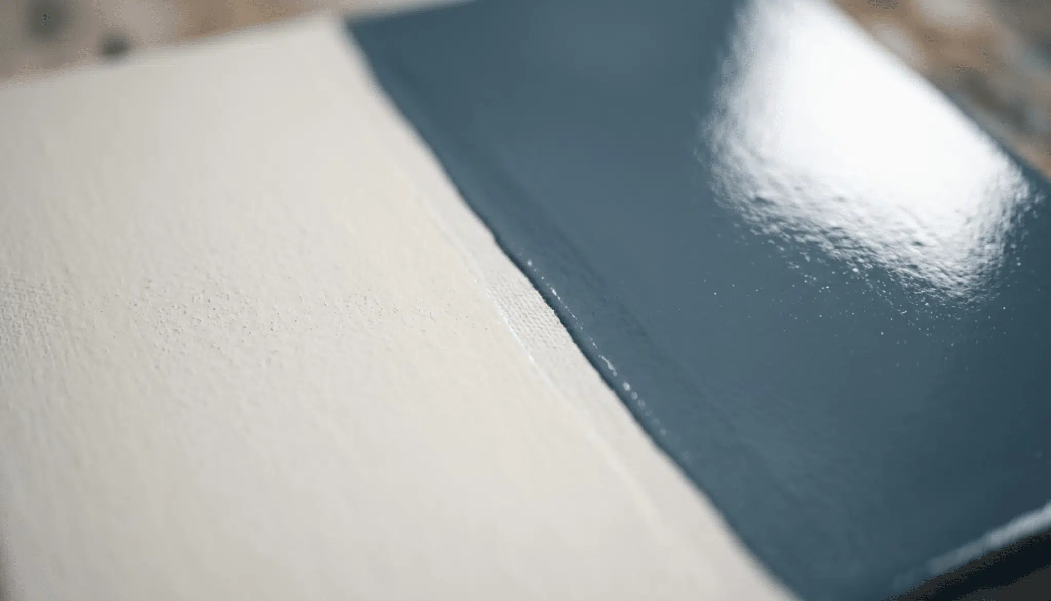 Paint swatch comparison showing matte satin finish beside glossy semi-gloss finish