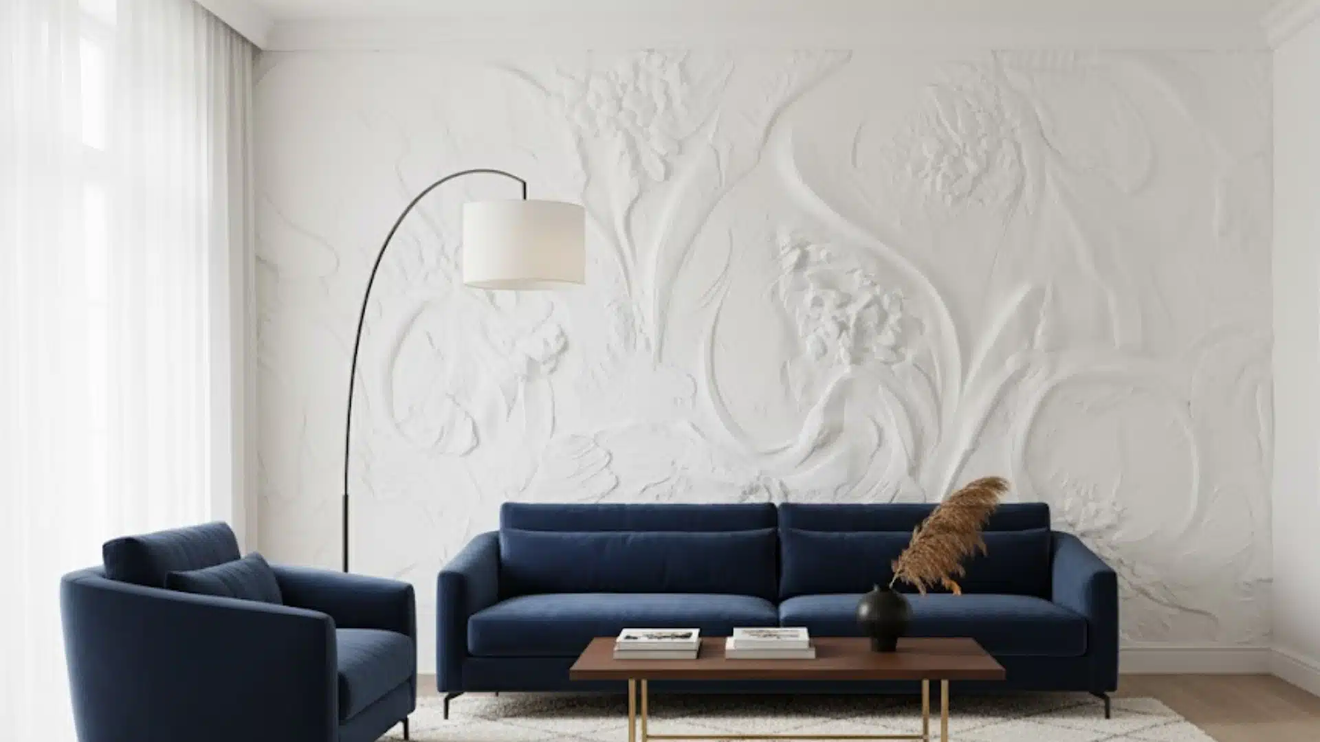elegant living room with navy seating and sculpted white bas relief feature wall