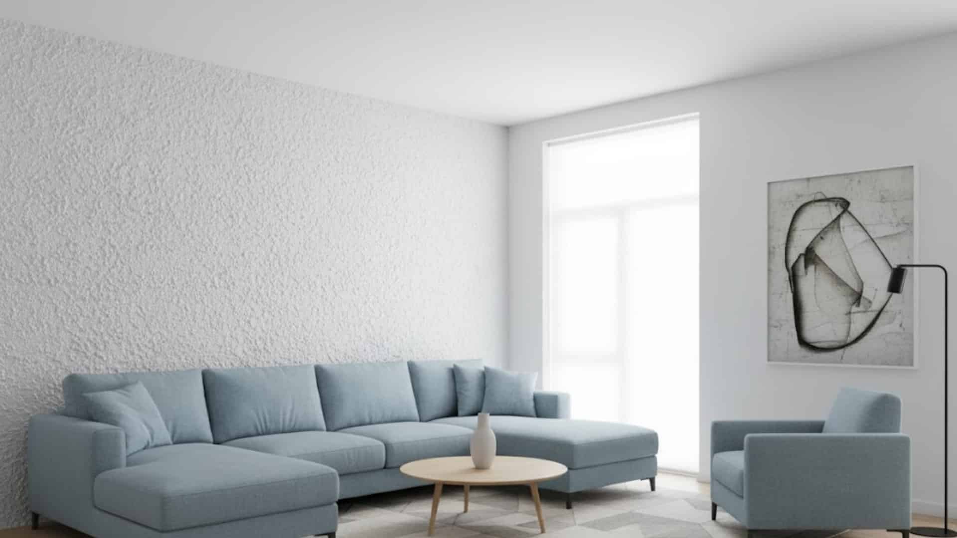 modern living room with blue sectional sofa and white popcorn textured feature wall