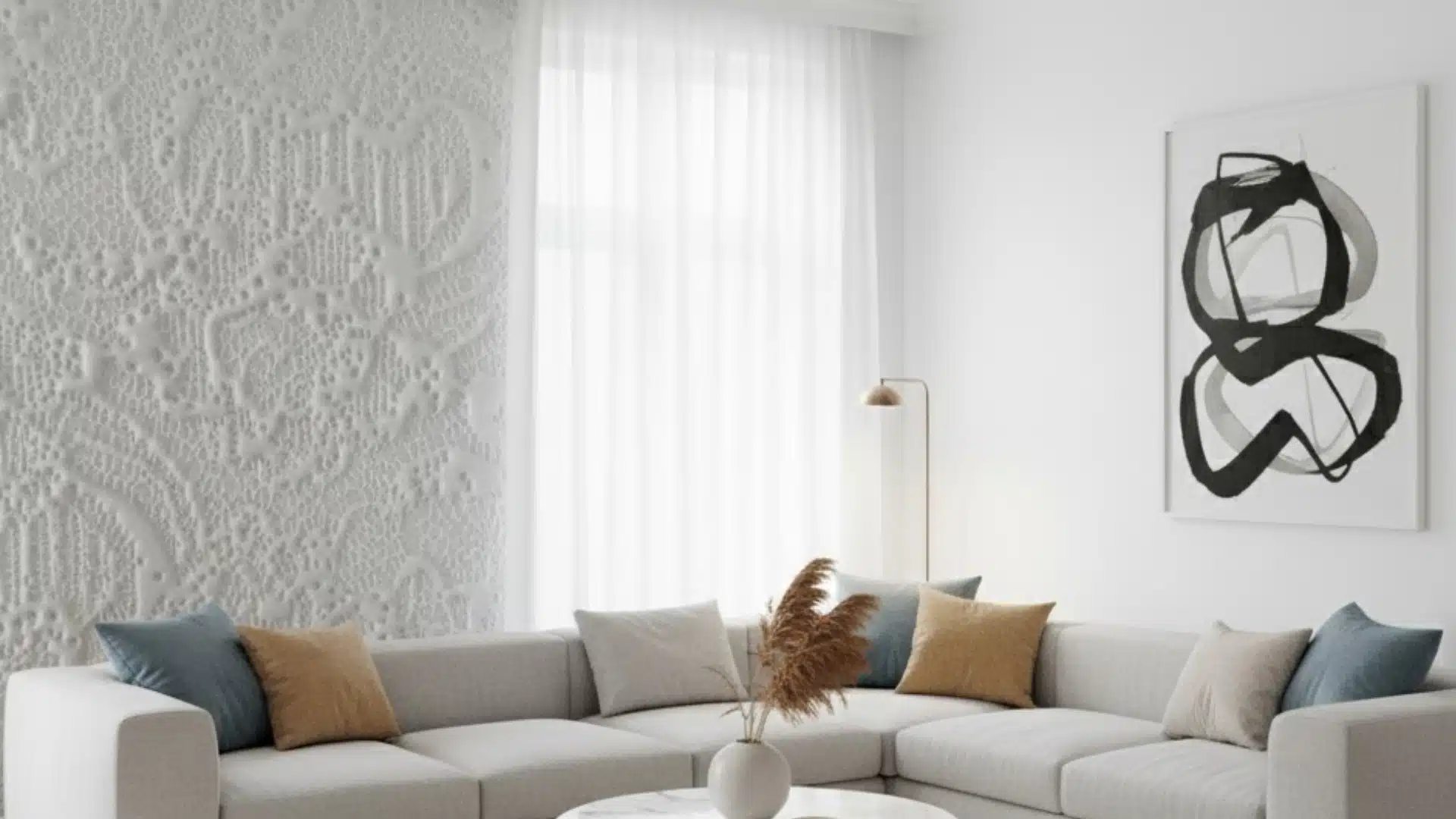 bright living room with white sectional and detailed spanish lace textured accent wall